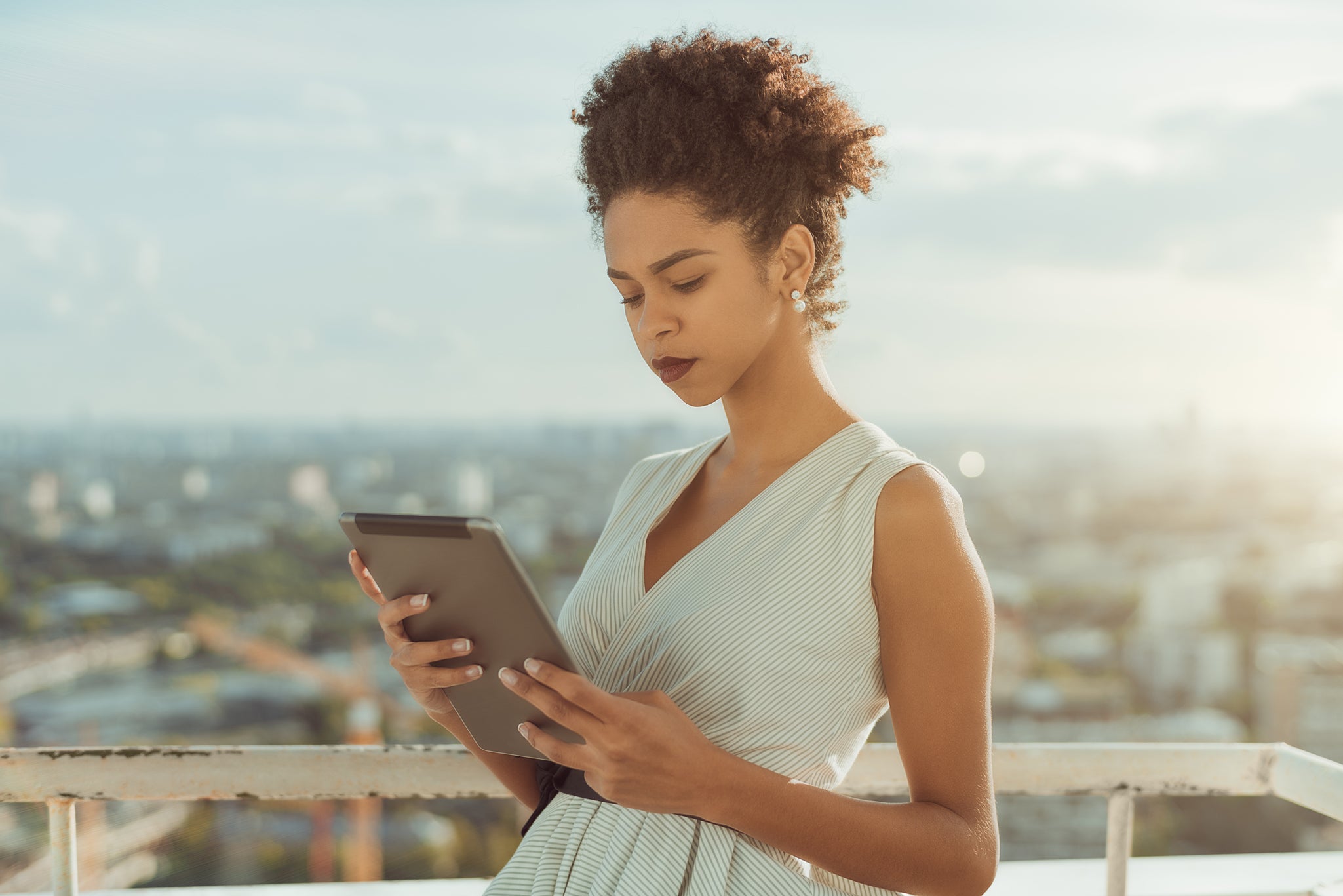 Woman Reading Tablet_ Creative Ways to Manage Your To-Do List